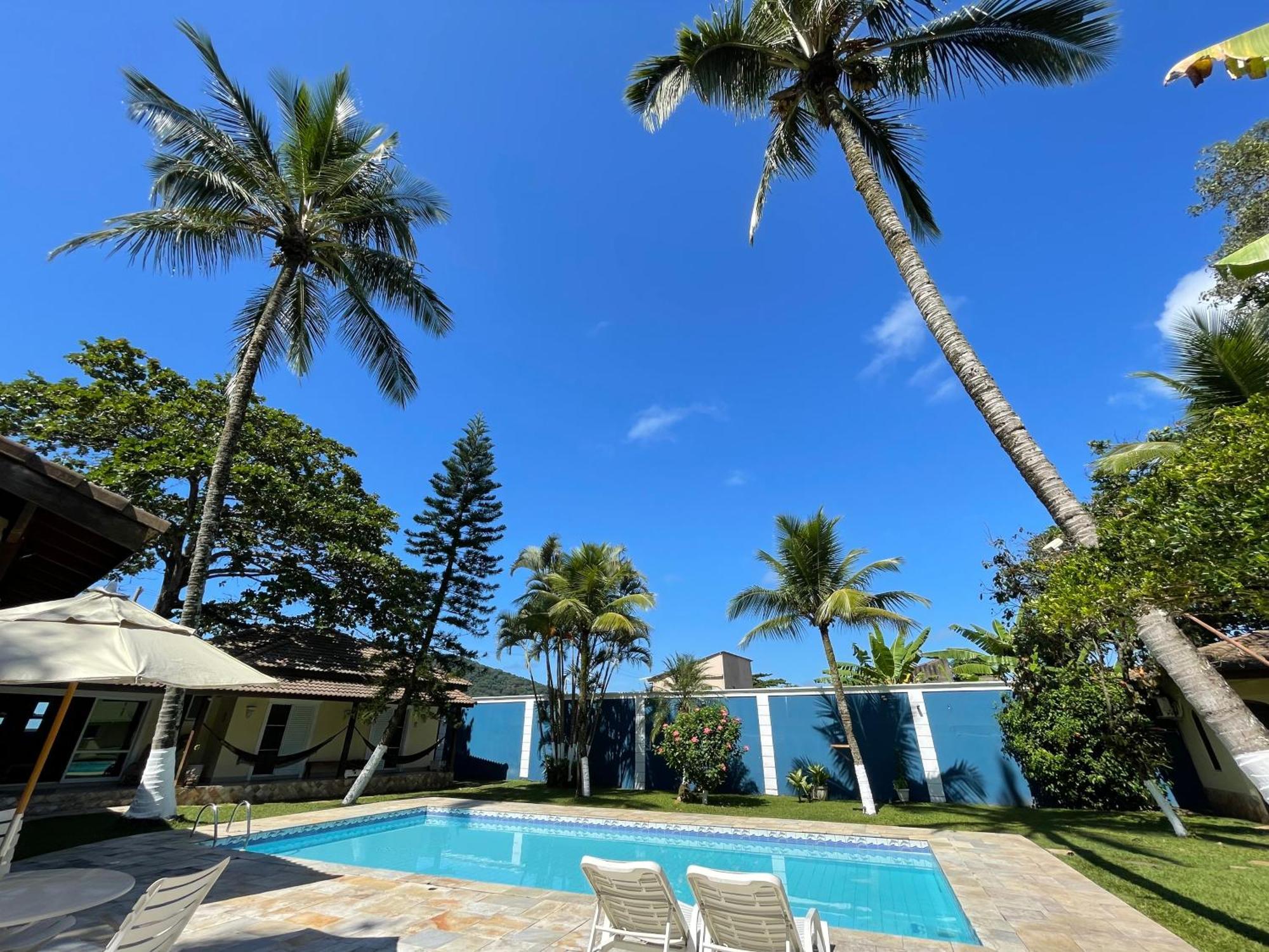 Acomodação com café da manhã  Recanto Divino - Pe Na Areia - Quartos Host Guarujá